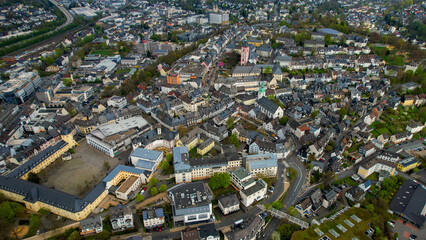 Fototapeta premium Aerial view around the old town of the city Siegen, Germany on a cloudy spring day