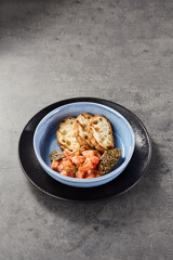Salmon tartare with ciabatta and olive tapenade, bright mood, overhead minimal composition