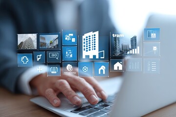 Businessperson using laptop with virtual building and data icons