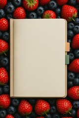 A blank beige notebook with tabs placed over berries, serving as a background with free space for text. Generated AI.