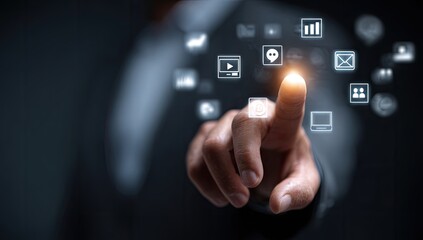 Businessman's finger touches glowing digital icons