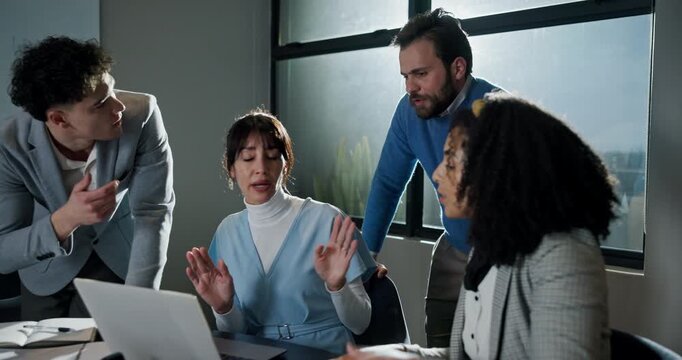 Business, people and laptop with fight in office for submission error, headline mistake or blame. Journalist, team or frustrated at publishing agency for story criticism, conflict resolution or flare