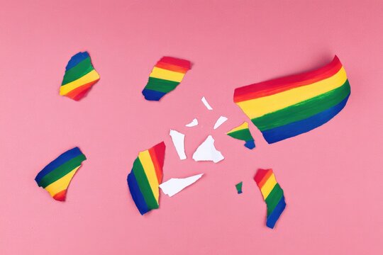 Shattered rainbow flag on pink background