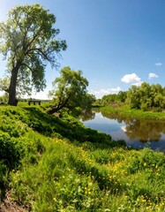 Serene riverbank scene showcasing lush greenery, vibrant yellow wildflowers, and a tranquil blue sky.