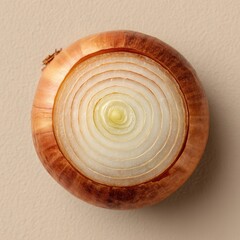 Obraz premium Overhead view of a whole onion, sliced in concentric circles