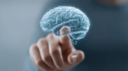 Digital representation of a human brain displayed in a futuristic style as a holographic image, with a hand reaching out to interact with it
