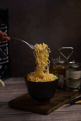 Instant noodles, cooked and ready to eat on the dining table