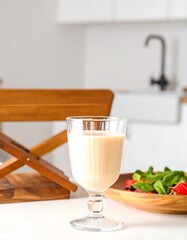 Creamy smoothie in a glass, healthy kitchen scene