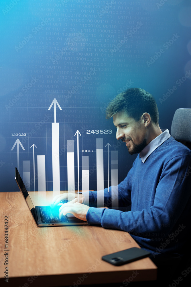 Poster man working on laptop with data analytics graph in modern office setting during day