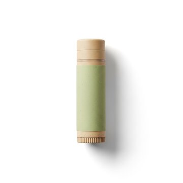 Beige and green lip balm tube isolated on white background for beauty and health care