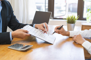 Asian landlord, realtor man pointing on paper for sign signature contract with tenant rental or...