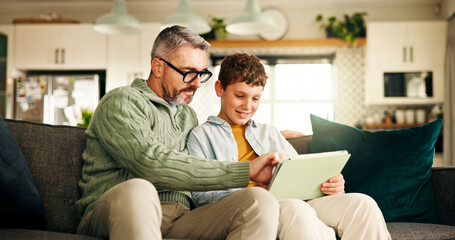 Home, father and son with tablet, help and bonding together with online game, entertainment and...