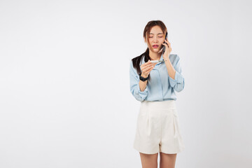 Woman sick, disease setting in, talking on her phone and checking temperature with thermometer, she looks worried she may be sick, calling doctor to explain her flu symptoms, isolated white background