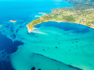 Seacoast with shades of turquoise water with beaches and blue lagoons in Karidi in Sithonia Peninsula, Vourvourou bay, Halkidiki, North Greece