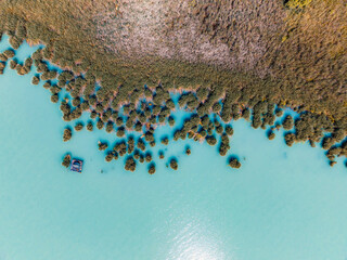 Lake Balaton in Hungary. Beach textures with boats with reeds and piers, aerial view
