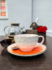 Cozy Cafe Table with Tea and Sunglasses