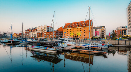 Gdansk with Motlawa river in Poland. Old town colourful house with saint Marys church i main square.
