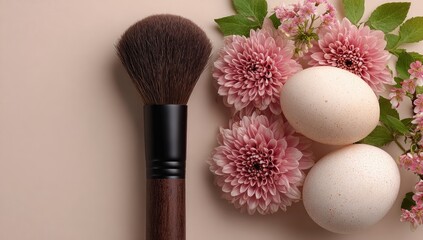 Makeup brush, eggs, and flowers on beige
