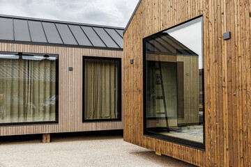 Modern Tiny House with Timber Cladding and Large Window