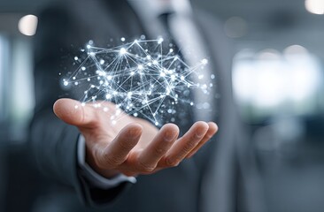 A businessman's hand holds a digital network graphic