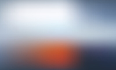 Soft, blurred focus on a warm orange glow against a cool blue and white background, evoking a sense of calm and transition.