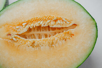 Ripe melon cut showing sweet orange flesh and seeds