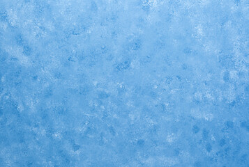 Textured blue plaster wall with soft cloud-like surface pattern