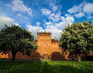 Red brick fortress gate, spring trees