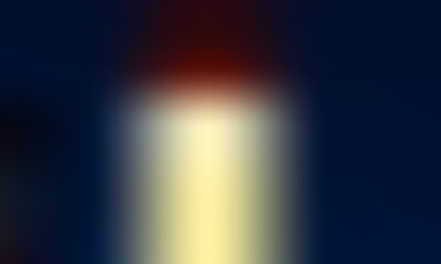Soft focus beam of warm light emerges from a dark background
