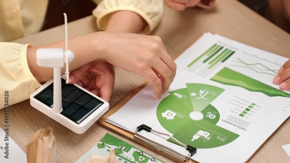 Poster business team analyze green power graph usage. coworker with windmill model represented using clean 