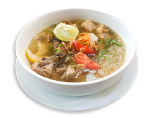 Delight in this flavorful bowl of Soto Mie soup featuring tender beef, a medley of fresh vegetables, and a zesty slice of lime, all simmering in a savory broth served on a wooden table.