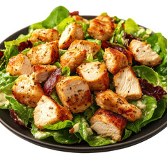 Delicious chicken salad featuring grilled chicken pieces on a bed of fresh greens with a creamy dressing served on a dark plate against a on transparent background