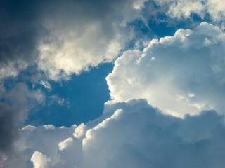 Blue Sky Window Among Dramatic Clouds