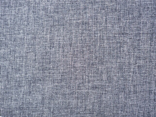 Textured grey fabric weaving intricate patterns, revealing detailed textile surface suitable for graphic design and creative applications