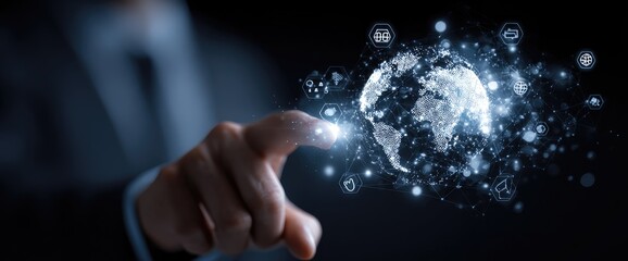 A hand hovers over a holographic projection of a globe surrounded by digital icons, suggesting global interconnectedness and technology