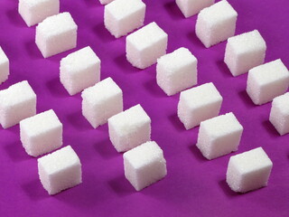 sugar cubes on a colored background.