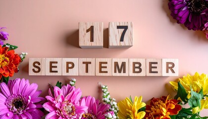 Wooden Blocks with Date 17 September. Floral Calendar – Vibrant Flowers on Solid Colored Background