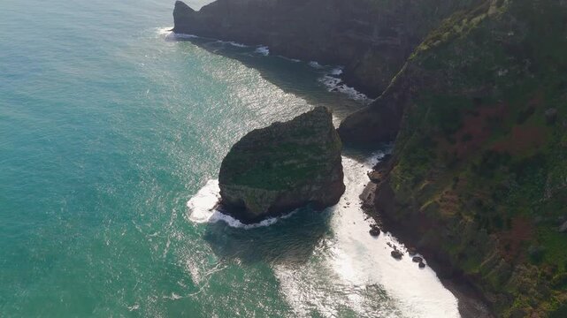 Aerial Drone Bird's Eye View of Ilh&eacute;u da Rocha do Navio and Lush Green Cliffs, Rocha do Navio National Nature Reserve, Madeira, Portugal