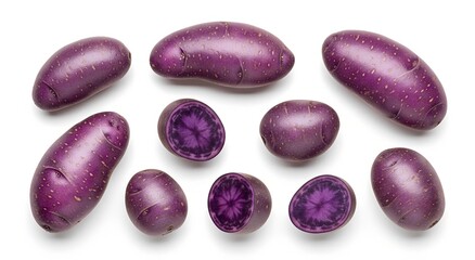 A collection of whole and halved purple potatoes with vibrant purple flesh on a white background.