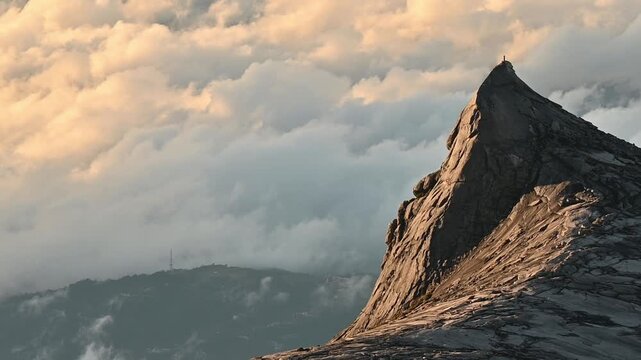 Footage of an iconic peak named South Peak on Mt.Kinabalu, Malaysia. Mount Kinabalu is the tallest mountain in Malaysia and Borneo.