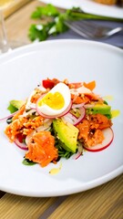 Fresh salmon salad with egg and avocado