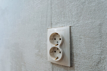 This feature includes a Dual Electric Power Outlet mounted on a stylishly Textured Wall, enhancing...