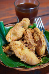 Indonesian Fried Banana, captured on September 2, 2025. Traditional snack of ripe banana coated in crispy golden batter, served on rustic plate, authentic homemade flavor