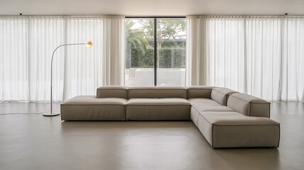 Minimalist living room with large beige sofa and sheer curtains