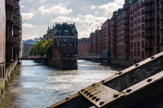 Speicherstadt in Hamburg, Germany, with red brick warehouses along the canal and bridges, UNESCO World Heritage Site highlighting industrial past and urban cultural heritage
