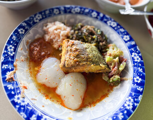 Indonesian traditional food. Indonesian comfort food: Papeda (sago starch) served with turmeric fish stew (Kuah Kuning). A traditional delicacy from Maluku and Papua.