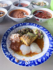 Indonesian traditional food. Indonesian comfort food: Papeda (sago starch) served with turmeric fish stew (Kuah Kuning). A traditional delicacy from Maluku and Papua.