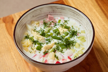 Enjoy a Bowl of Creamy Vegetable Soup with Tender Ham and Fresh Herbs, Comfort Food Bliss