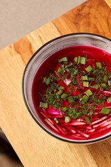 Deliciously Vibrant Beetroot Soup Garnished with Fresh Herbs for an Inviting Experience
