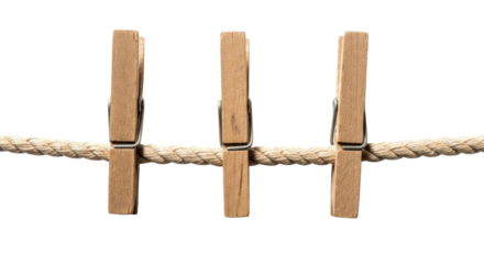 Three Wooden Clothespins on a Braided Rope Line cutout isolated on transparent bg, png